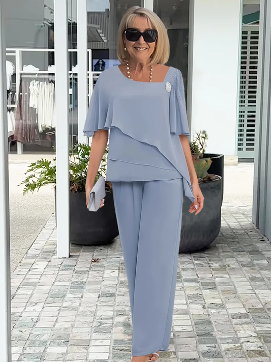 Vincenza — Completo con blusa asimmetrica e pantaloni a gamba larga