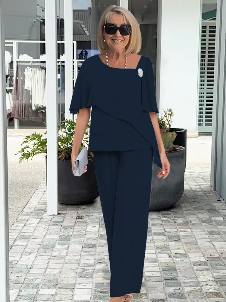 Vincenza — Completo con blusa asimmetrica e pantaloni a gamba larga