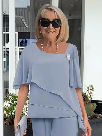 Vincenza — Completo con blusa asimmetrica e pantaloni a gamba larga